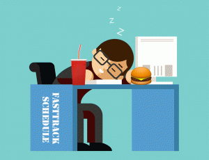 Employee sleeping at desk with lunch.